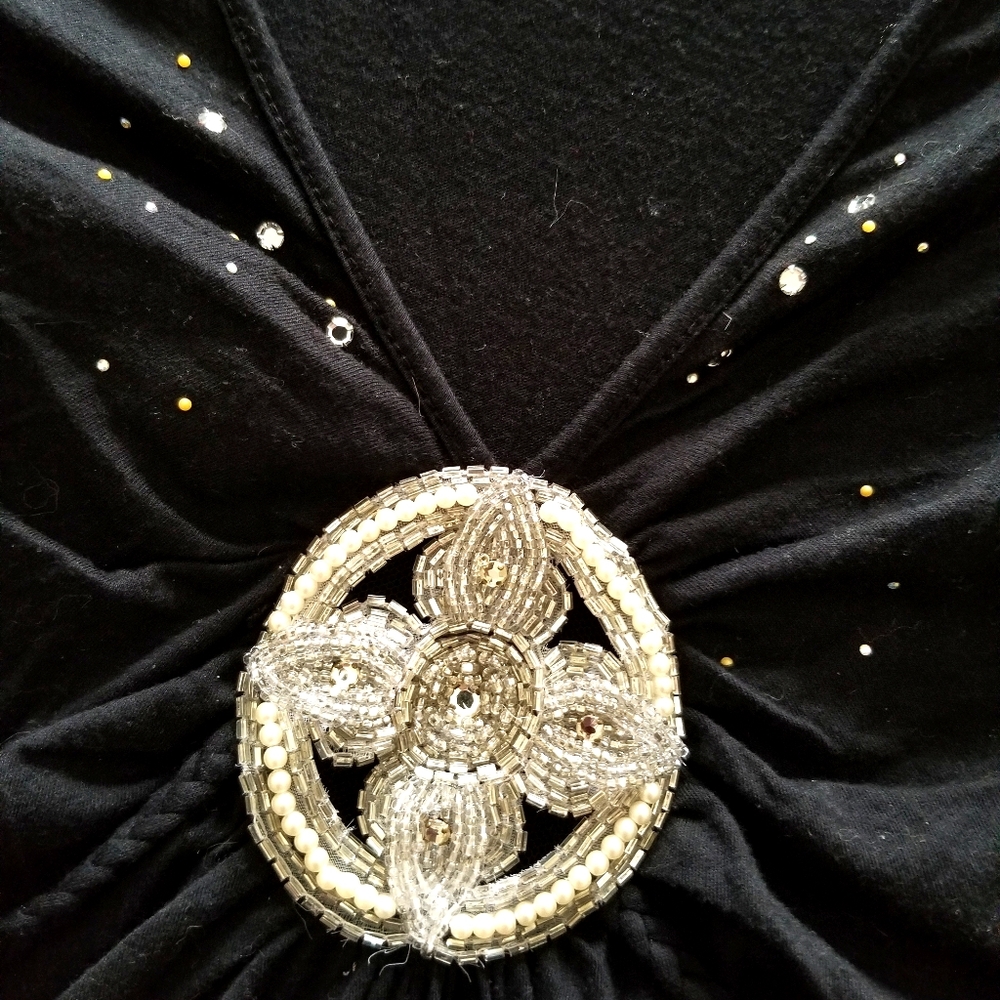 Top by language. Beadwork and tie around. Romantic